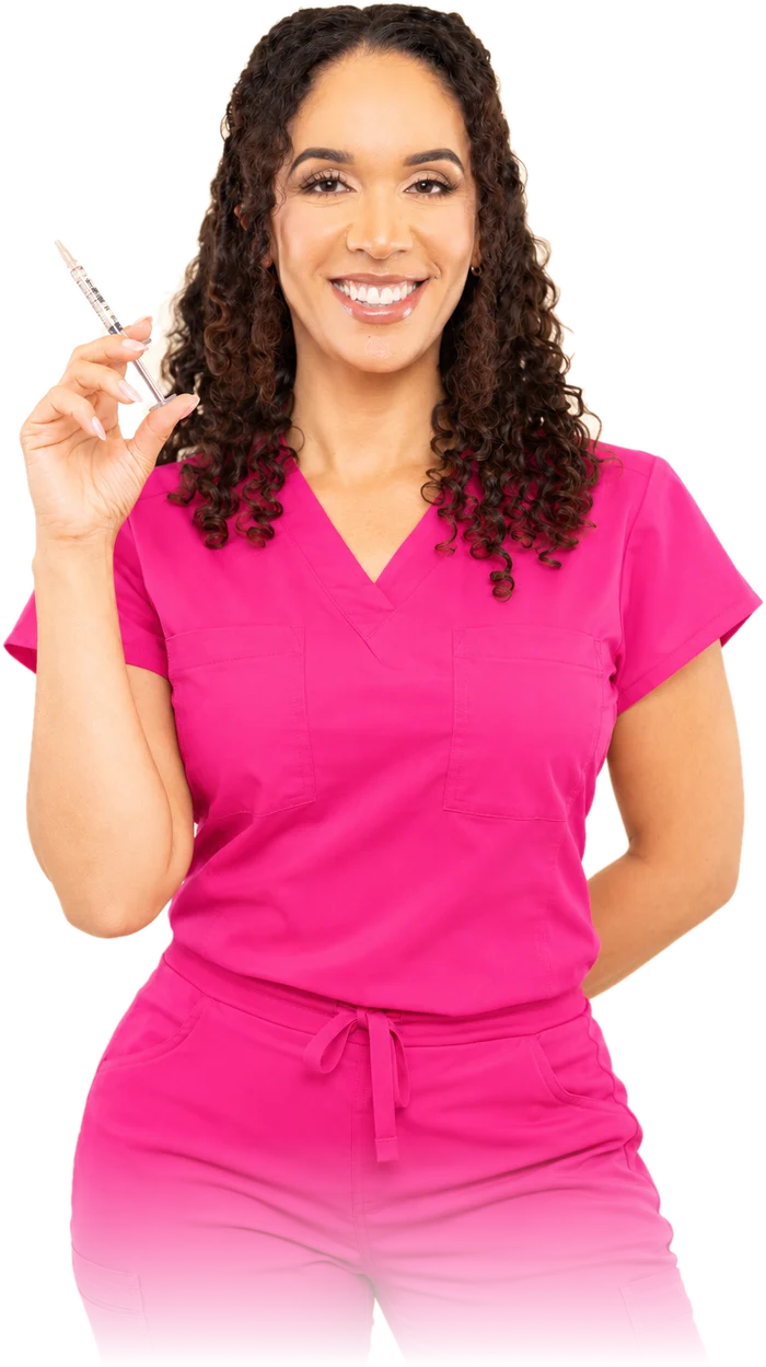 Cassie Lewis, NP, holding a syringe